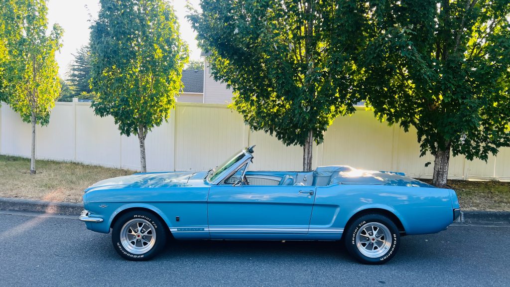 1966 Ford Mustang GT Convertible in Silver Blue, side profile with the top down
